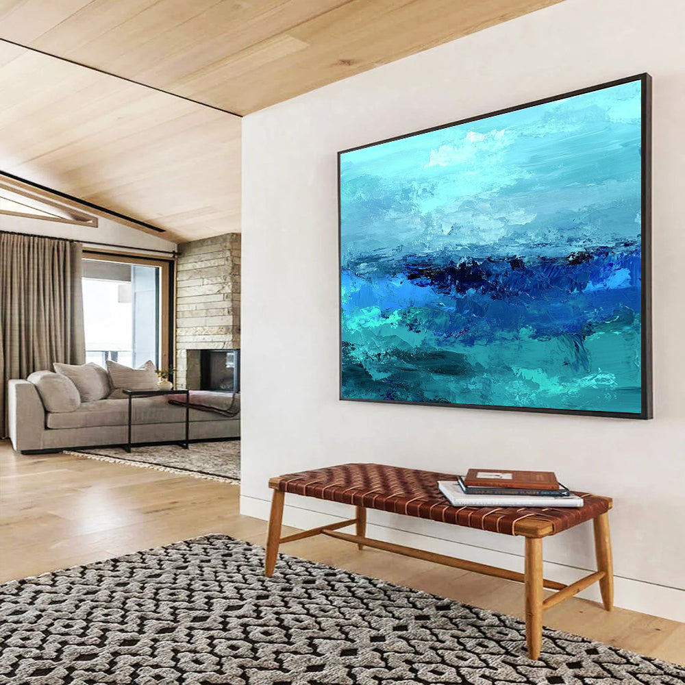 Large abstract ocean artwork in shades of aqua teal and navy with textured layers suggesting waves evokes tranquility and depth on canvas.SC035