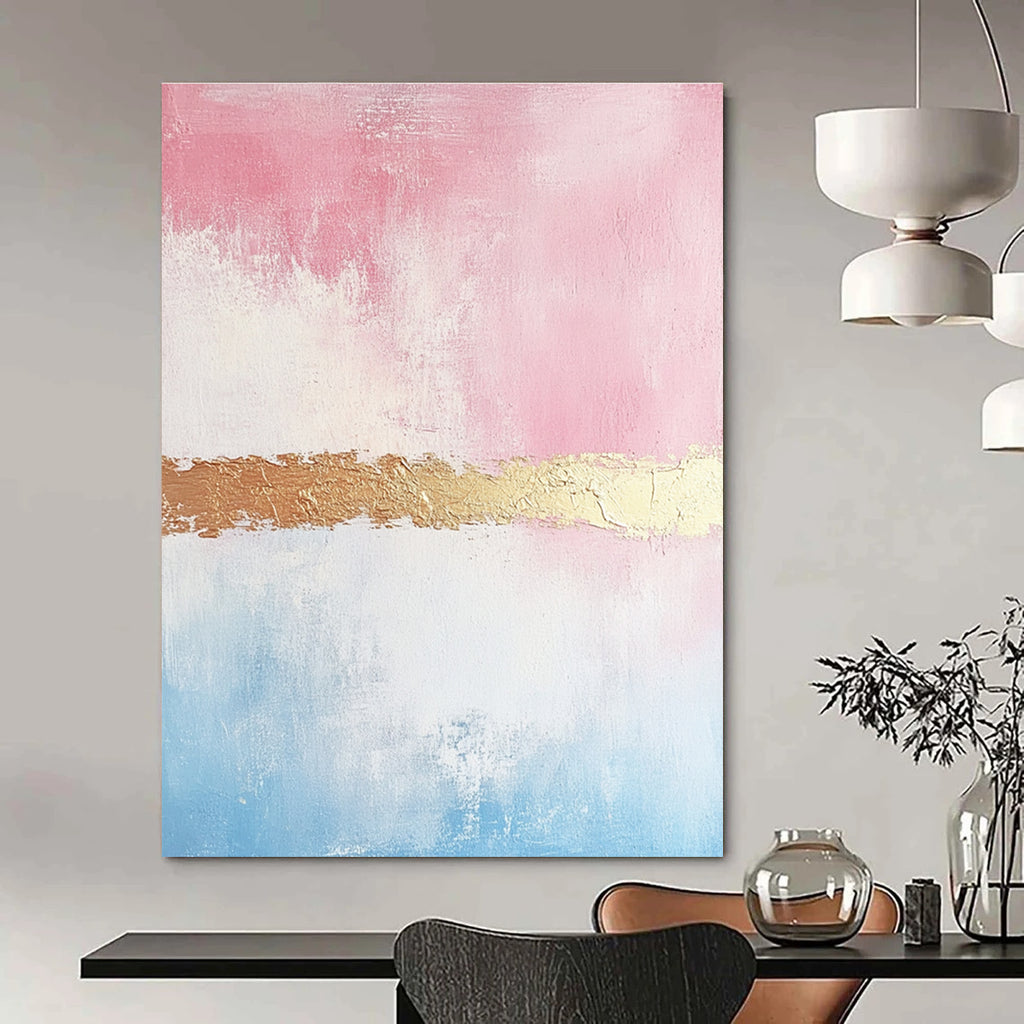 Large abstract painting with soft pink and gold tones textured brushstrokes and a delicate golden line enhancing its minimalist elegance.STSC454