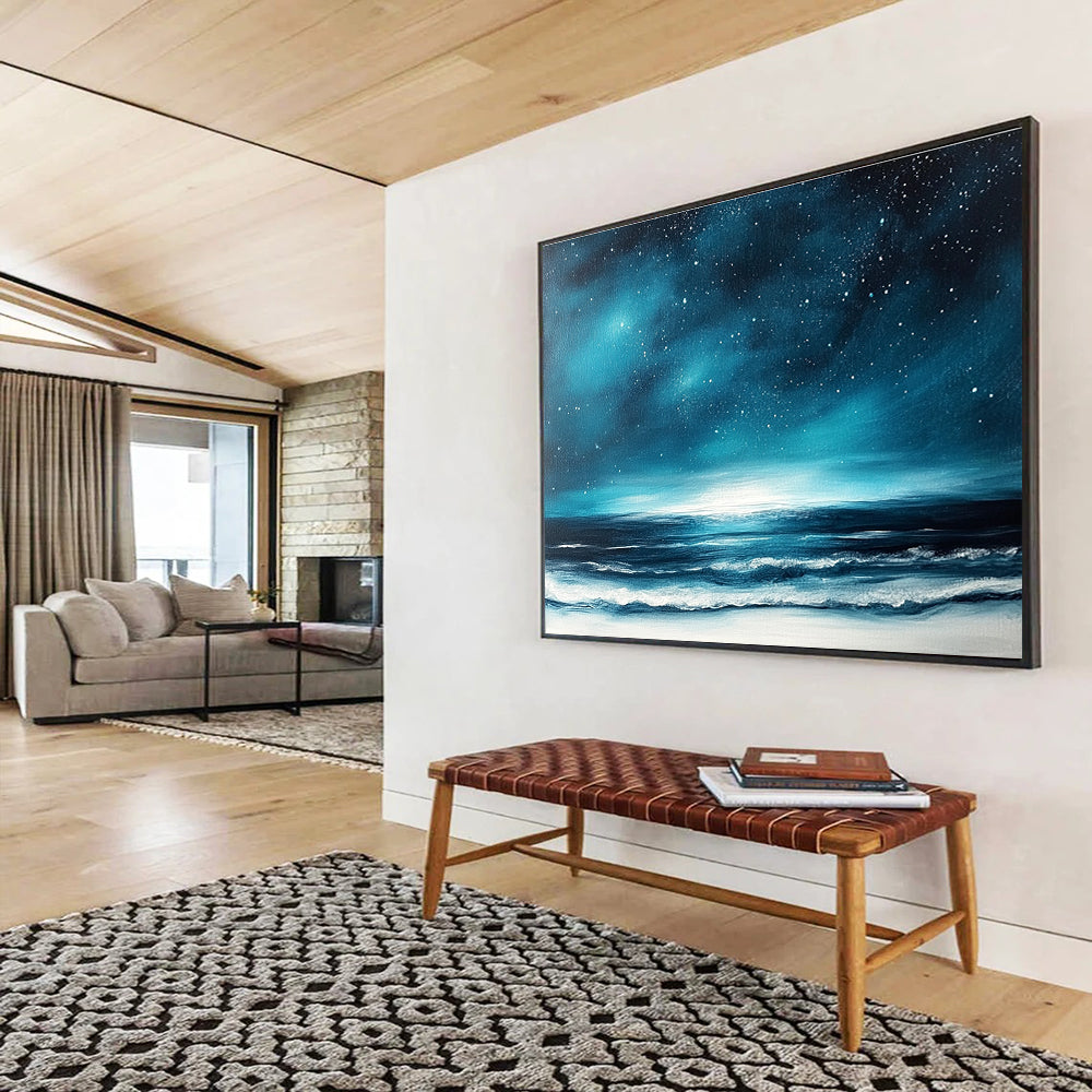 A large abstract painting featuring a dark blue sky with stars and ocean waves, accented with white and light teal hues.SC396