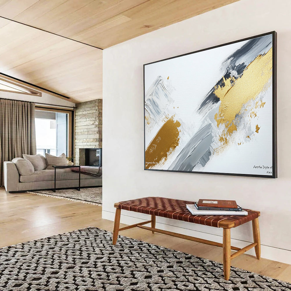 Large abstract painting featuring gray and gold brush strokes on a white background showcasing contemporary artistic creativity and elegance.SC293