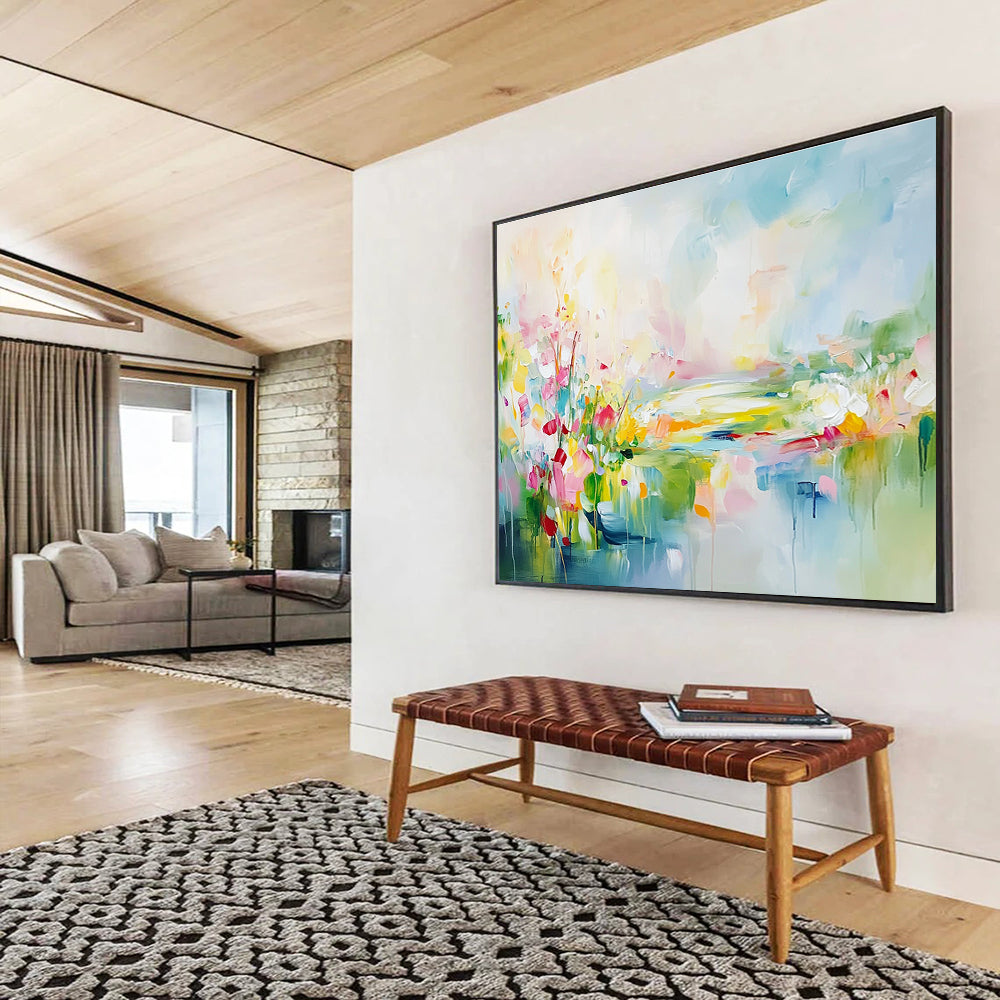 Large abstract landscape painting featuring spring flowers in a colorful meadow with a flowing river vibrant greenery and a serene sky.SC084