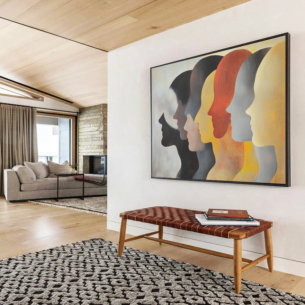 Large abstract painting featuring faces in profile with diverse skin tones and hairstyles in soft colors on a light background.SC548