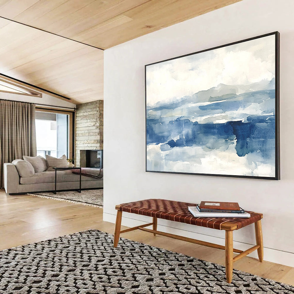 Large abstract painting of the sea features shades of blue and gray with soft clouds, evoking a stormy atmosphere and depth.SC289