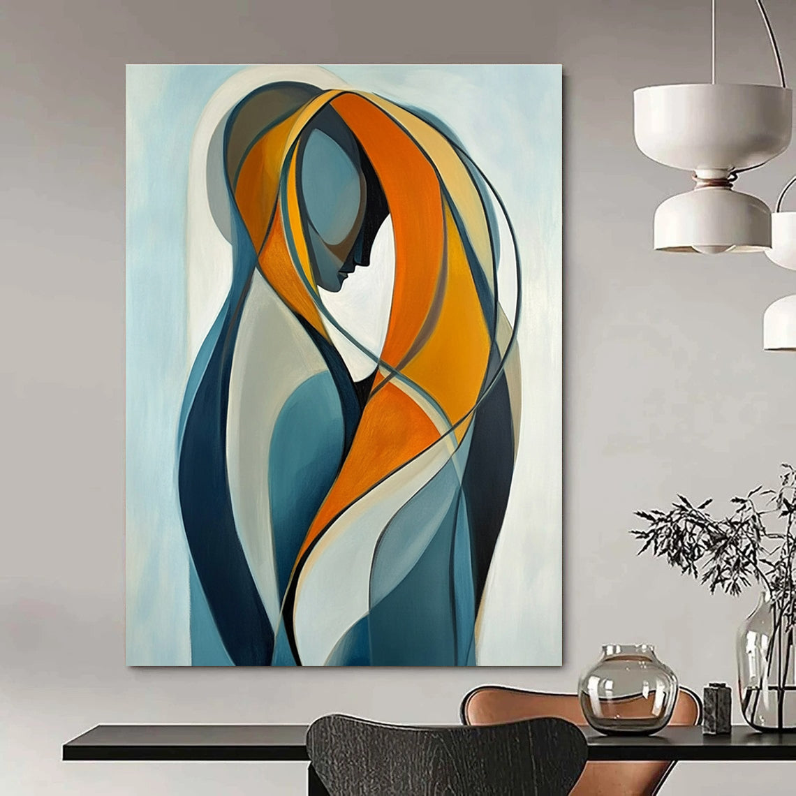 Large abstract painting of two intertwined figures in vibrant orange and yellow against a light blue background emphasizing connection and softness.STSC1143