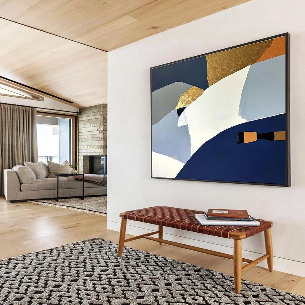 Large abstract painting featuring white blue and gold shapes against a dark gray backdrop with orange details and a soft yellow surface.SC444