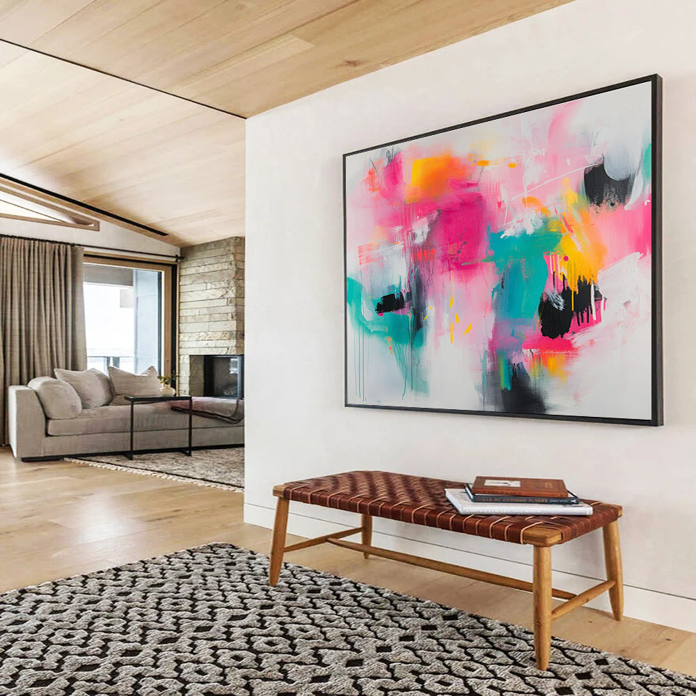Large abstract painting featuring vibrant splashes of pink teal and yellow on a white background with loose brushstrokes and chaotic shapes.SC387