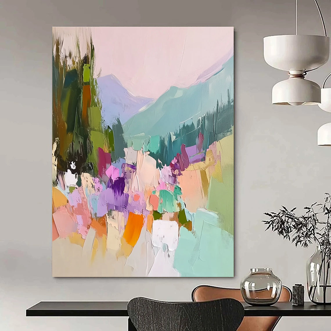 Large abstract painting featuring vibrant colors with trees flowers and mountains showcasing thick brush strokes and textured canvas in a harmonious light pink sky.STSC104