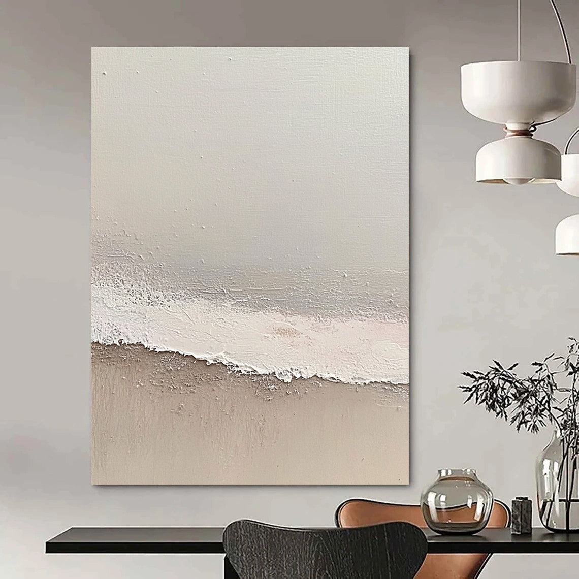 Large abstract painting depicting a serene beach scene with soft gray and pale pink tones featuring gentle waves and textured surfaces.STSC1427