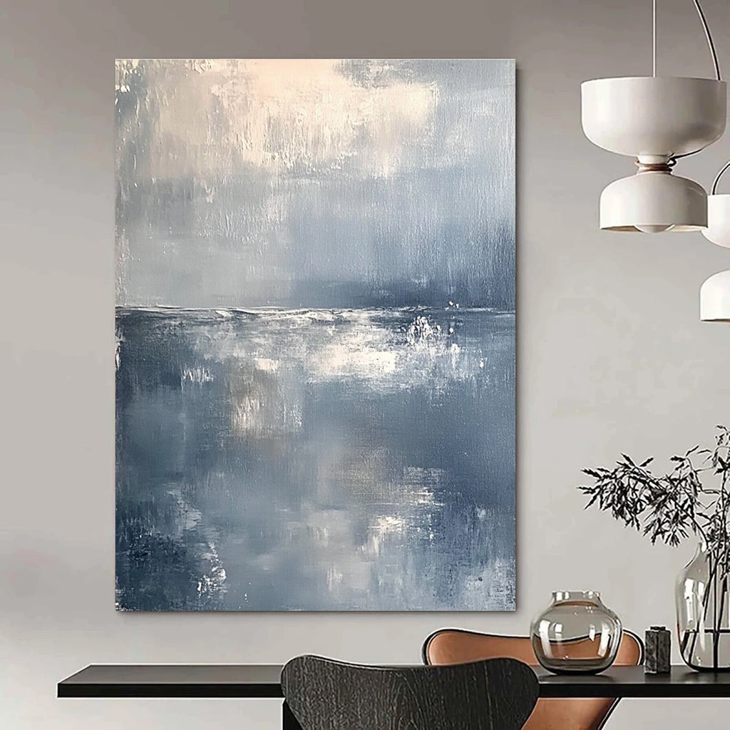 Large abstract painting of a serene ocean horizon in muted gray and white tones with soft brushstrokes conveying tranquility and elegance.STSC262