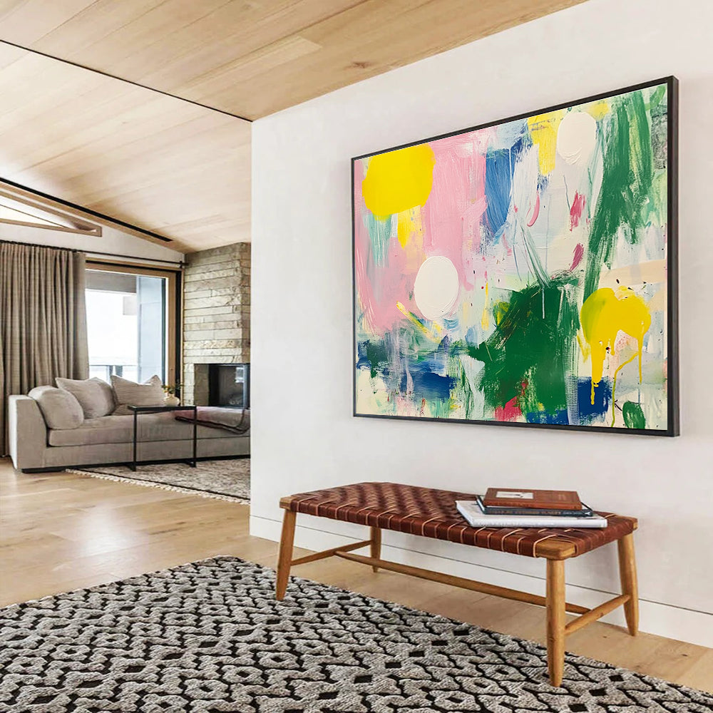 Large abstract painting featuring bright colors with green and pink shapes white circles yellow lines blue lines and light red elements on a white background.SC231