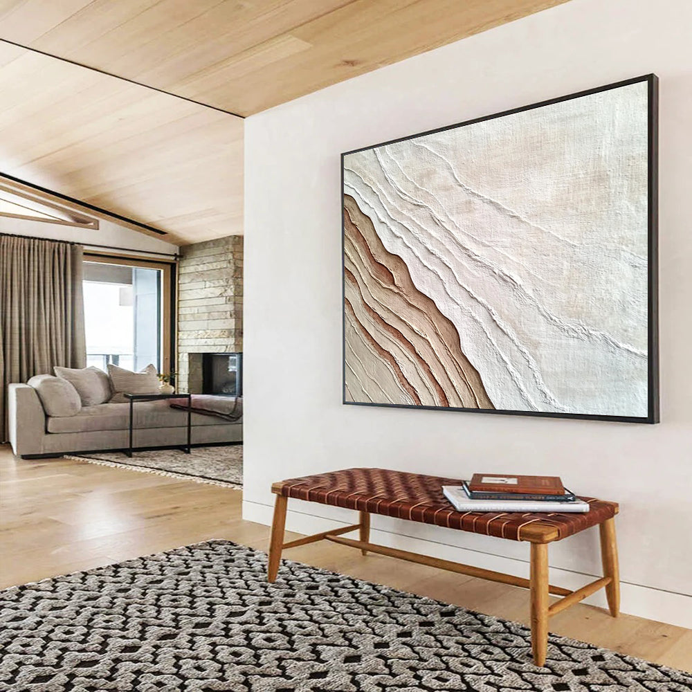 An abstract painting featuring the interplay of sand and water in white and brown hues, symbolizing growth and change through rich textures.SC448