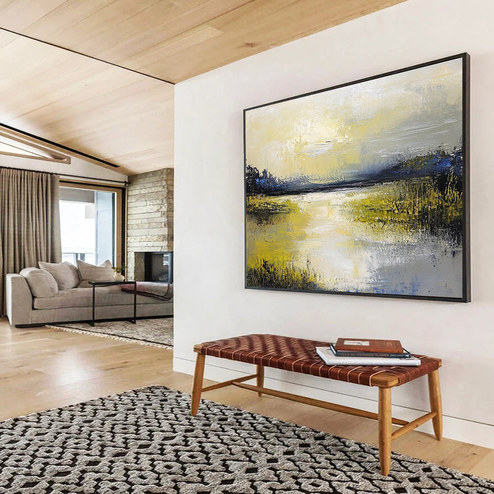 Large abstract painting featuring a serene lake and sky in soft yellow green blue and gray tones with thick textured paint.SC078