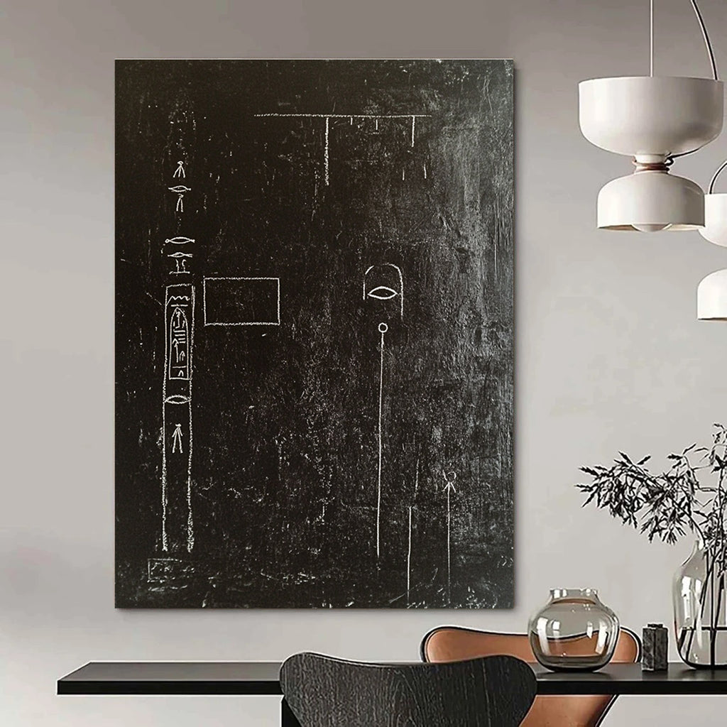 A large abstract painting featuring a black wall adorned with white chalk drawings of ancient Egyptian symbols and writing in high contrast.STSC918