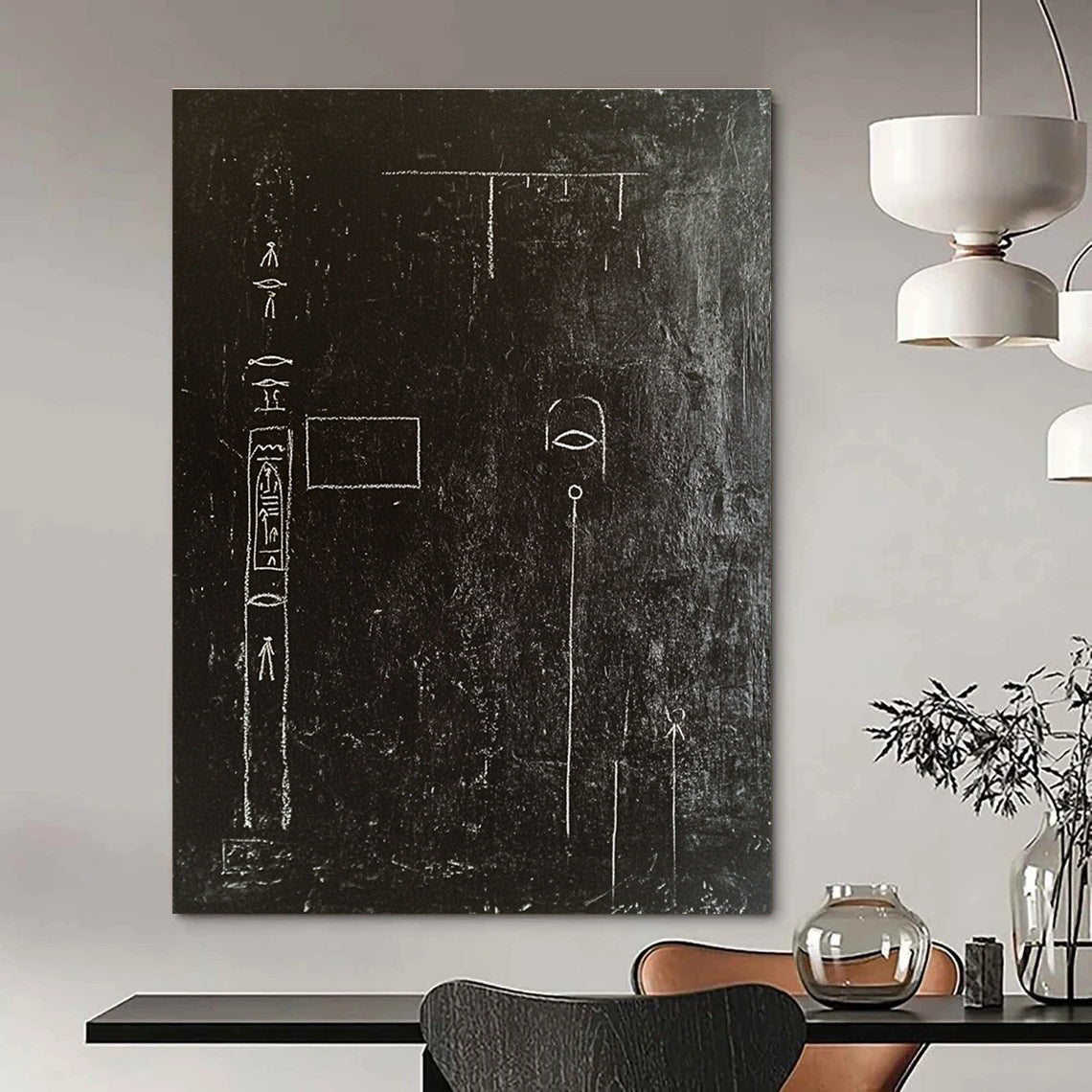 A large abstract painting featuring a black wall adorned with white chalk drawings of ancient Egyptian symbols and writing in high contrast.STSC918