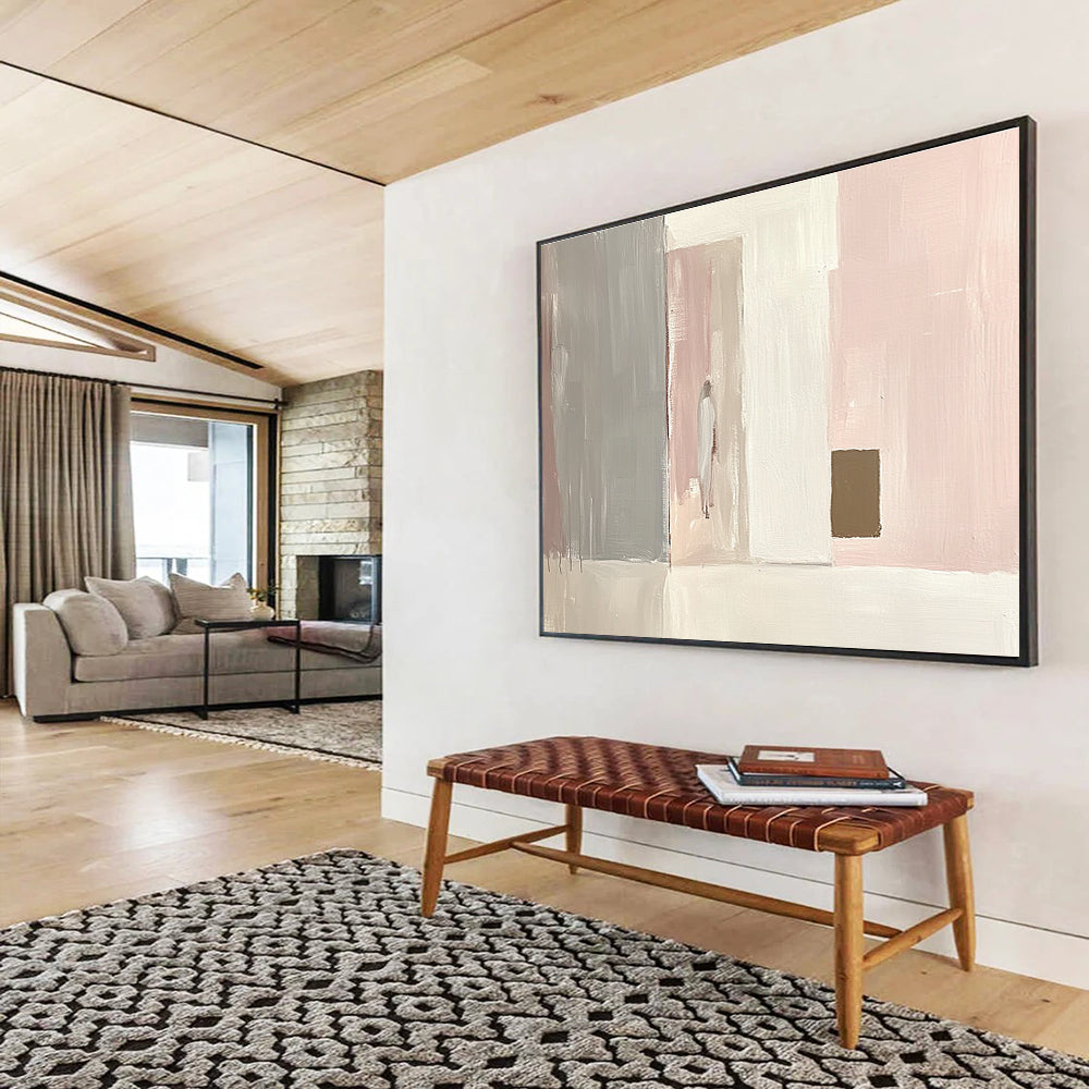 Large abstract painting in light pink and white with gray and a small brown square emphasizes minimalist brushstrokes and elegant simplicity in oil paint.SC223