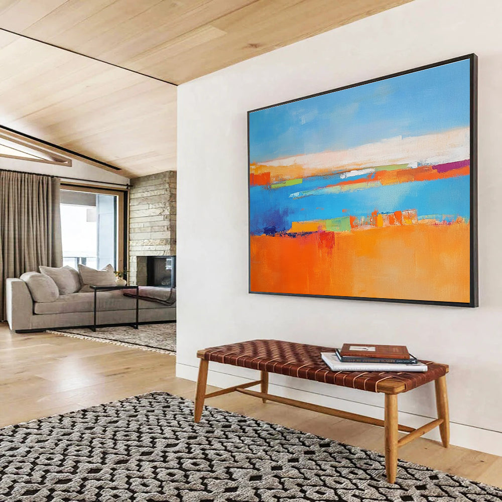 Large abstract painting featuring a soft blue background vibrant oranges geometric patterns warm yellows with green shapes and white figures symbolizing nature.SC060