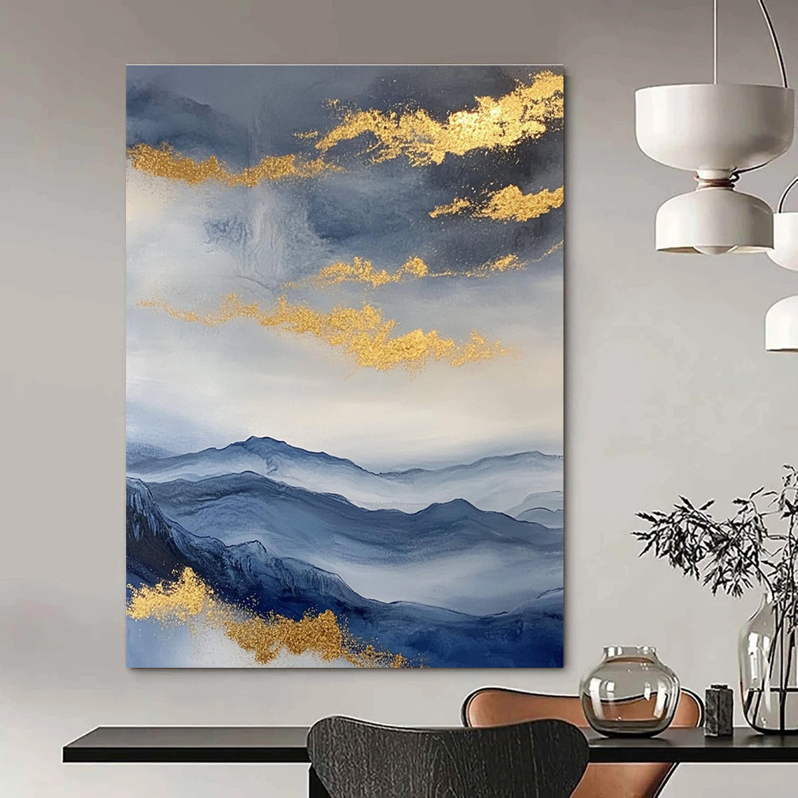 Large abstract painting featuring a beautiful sky mountains and clouds in blue and gray with gold foil accents.STSC279