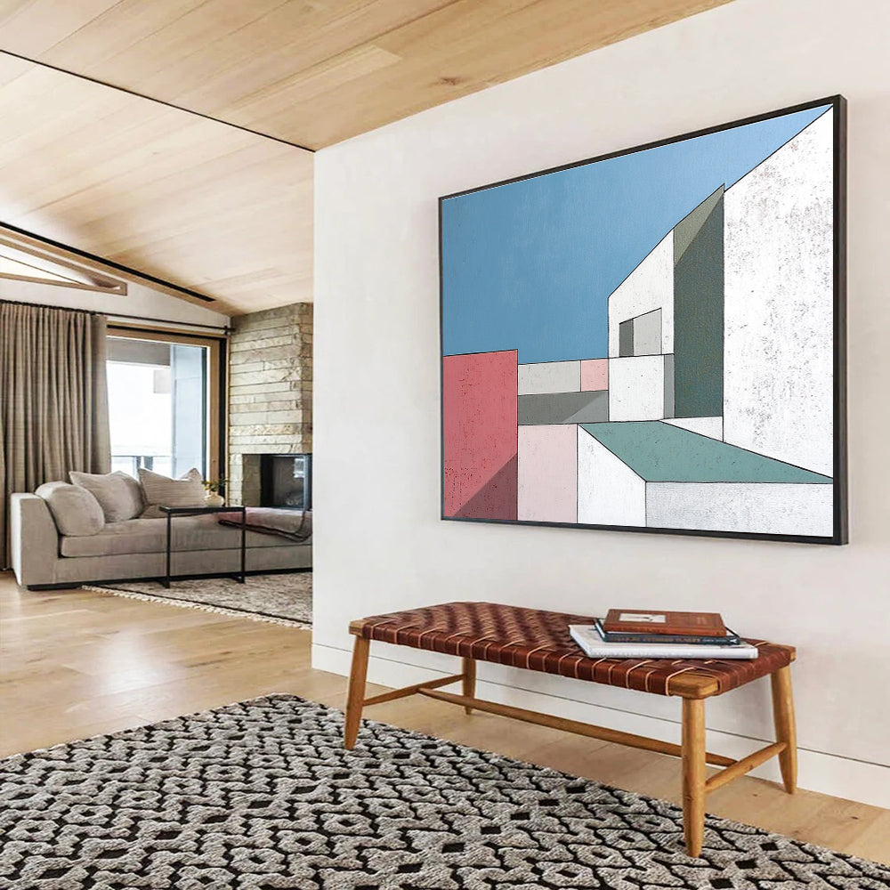 A large abstract painting featuring minimalist white buildings with large windows against a serene blue sky highlighting sharp color contrasts and geometric shapes.SC487