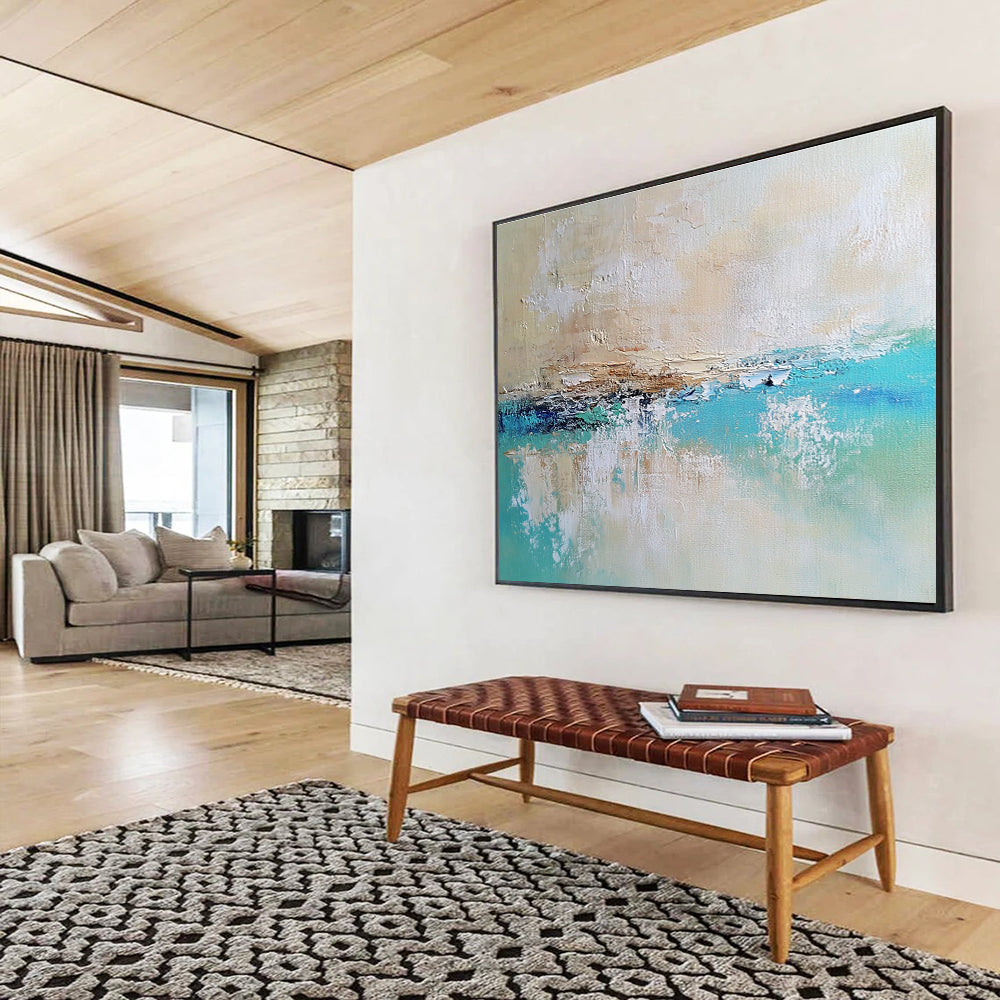 Large abstract painting of a calm sea featuring blue and green tones on a textured canvas with soft edges and neutral colors.SC340