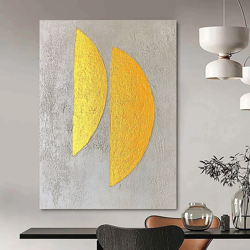 Large abstract painting featuring two yellow semicircles on a textured grey background with gold leaf highlights in a minimalist style.STSC356