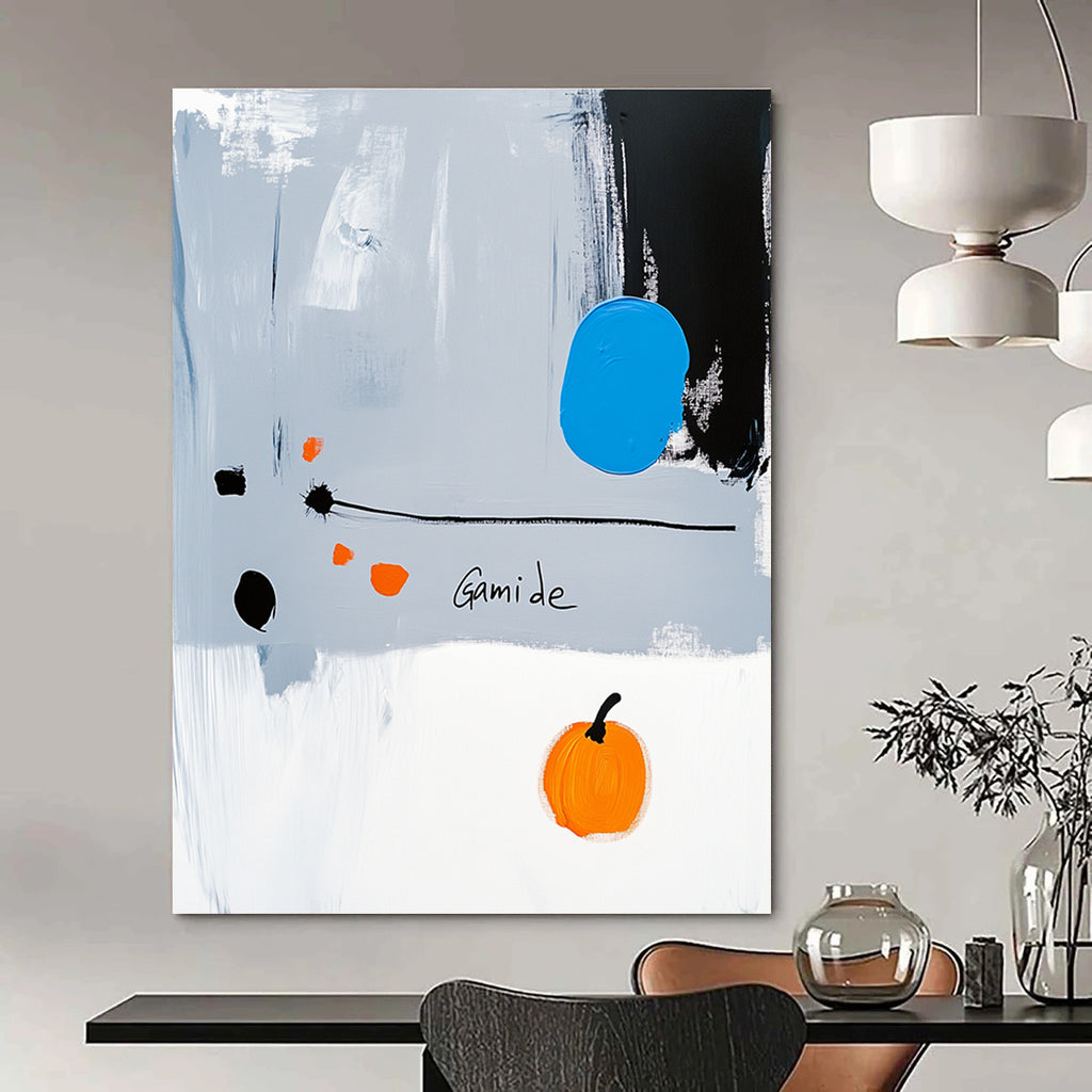 Abstract painting of a right-pointing arrow in blue white gray orange and black with Gamide text and a cartoonish pumpkin on light gray background.STSC1073