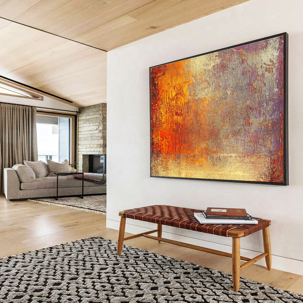 A large abstract painting featuring warm tones of gold reds and oranges evokes autumn's energy and symbolizes life's transitions with a golden sunset backdrop.SC432