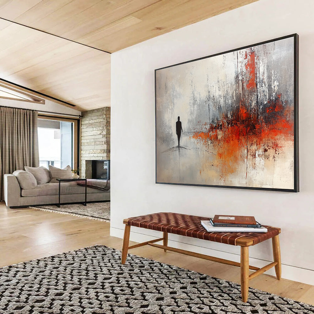 Large abstract painting in soft gray and white tones with red and orange splashes featuring a silhouette in an ominous landscape.SC258