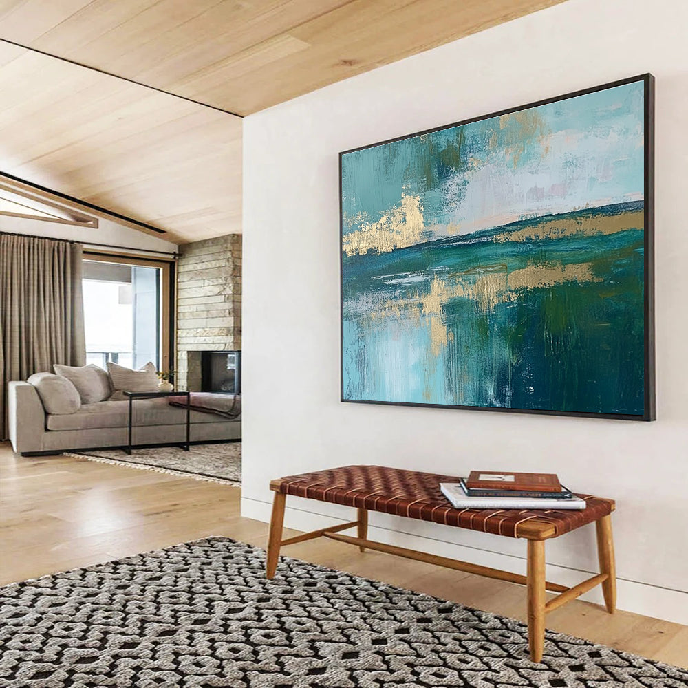 Large abstract painting featuring a serene lake, vibrant green fields, light blue sky, and elegant gold foil accents.SC115