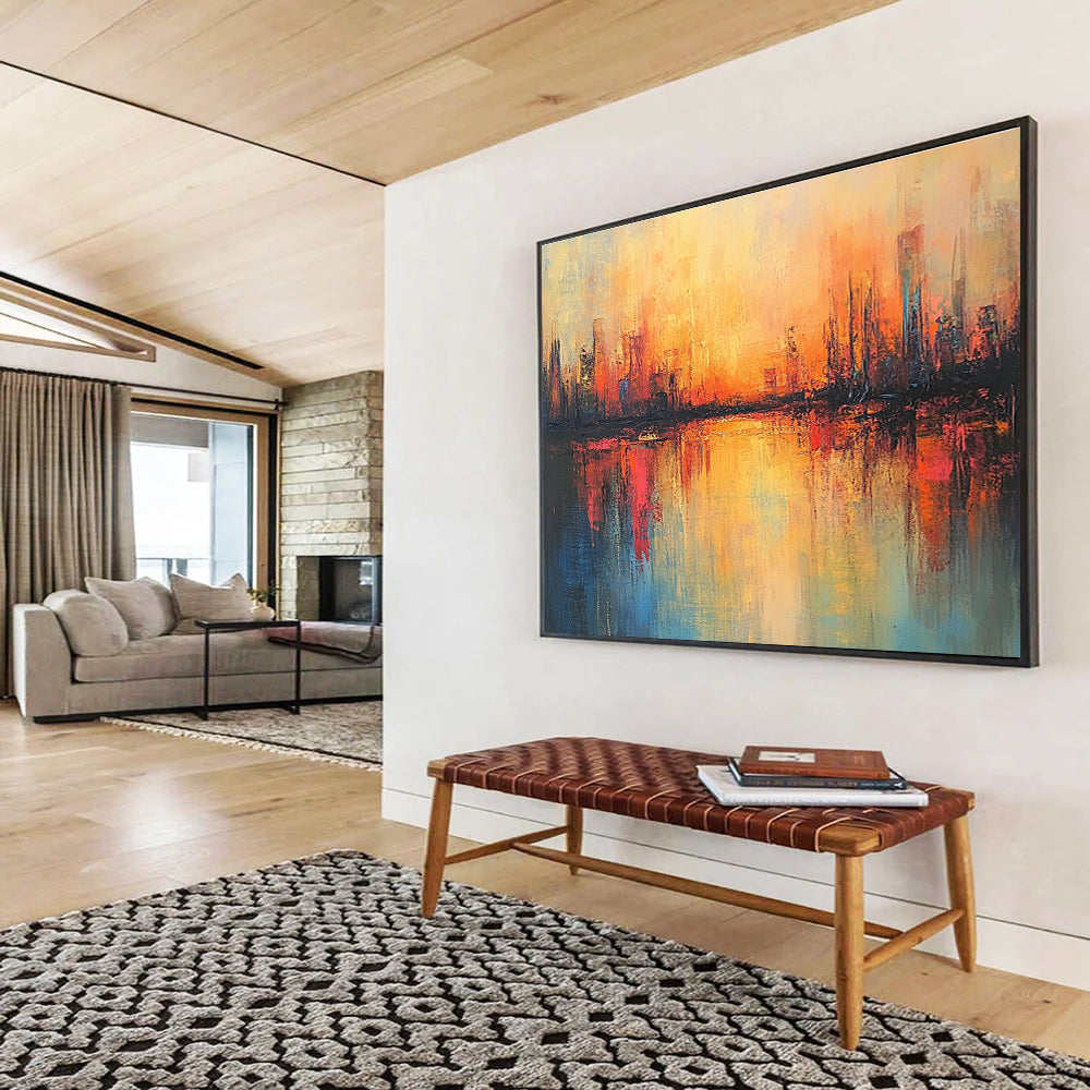 Large abstract painting featuring a cityscape in warm hues with soft brush strokes and reflections on calm waters, evoking a serene sunrise atmosphere.SC037