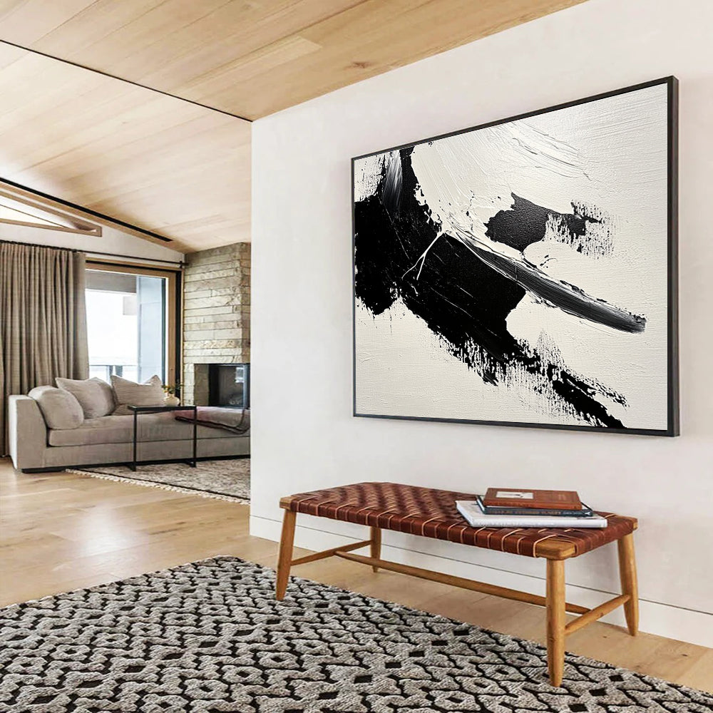 Large abstract painting featuring bold brushstrokes and textured areas of black and gray on a minimalist white background.SC574