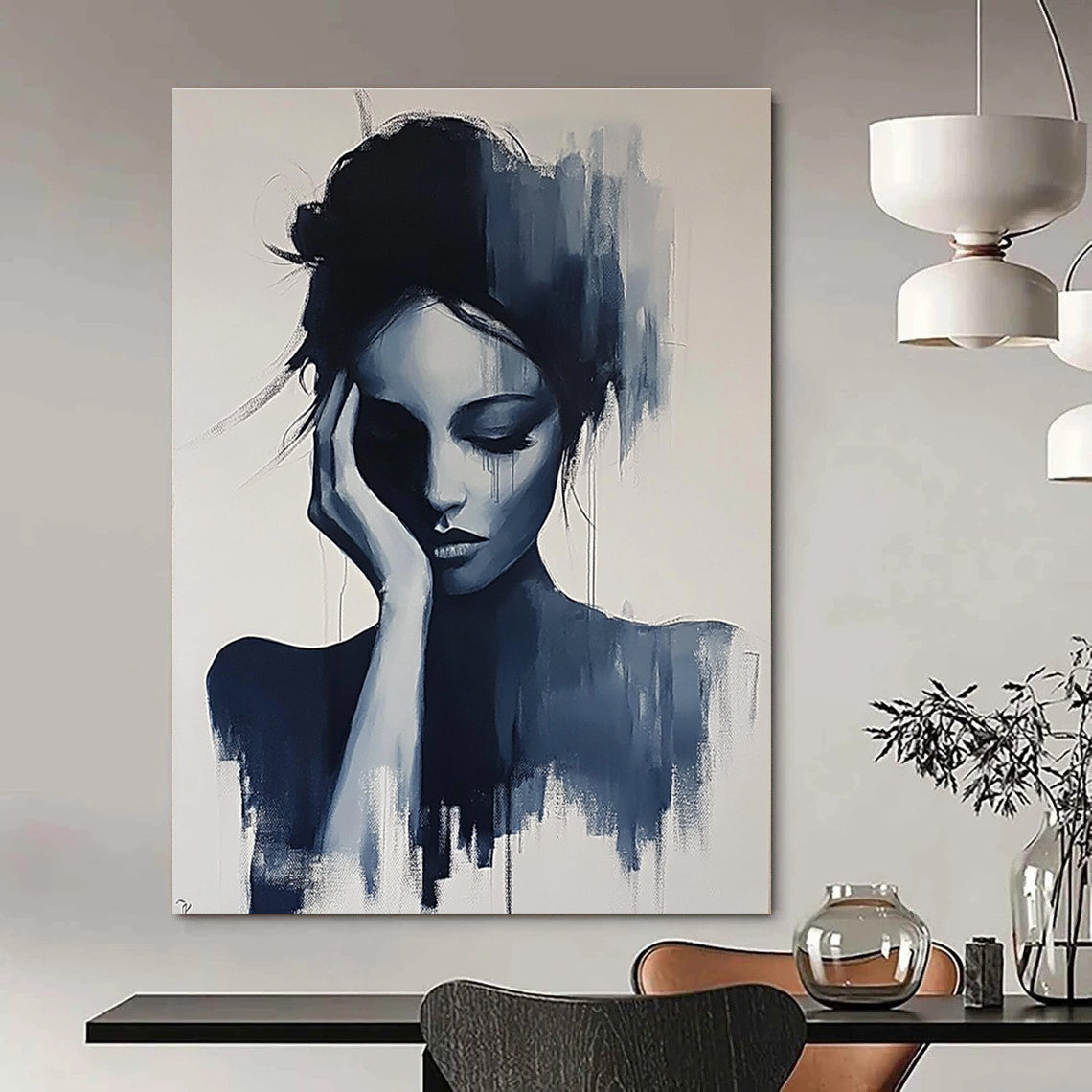 Large abstract painting of a gray woman with her hand on her face and hair up in black and white colors.STSC1378