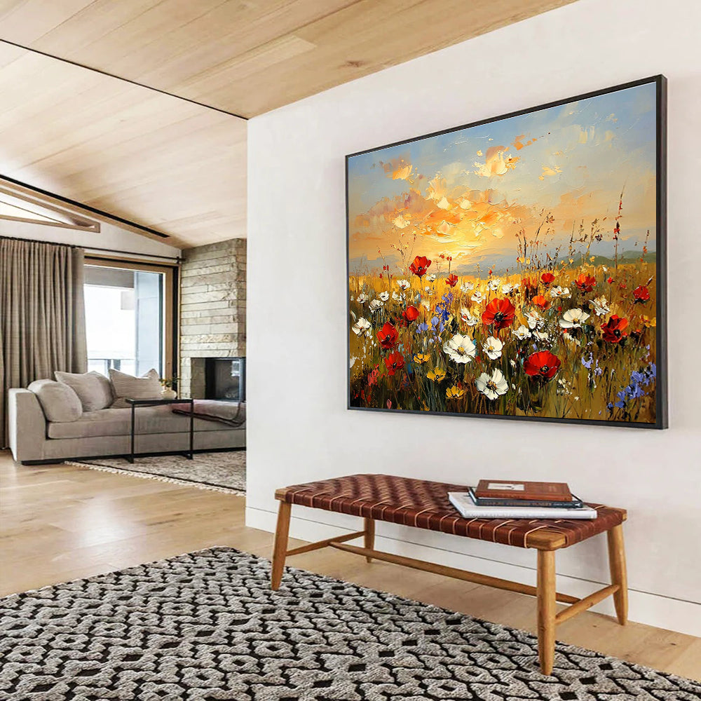 Large abstract painting of a wildflower field at sunset featuring red poppies white daisies and yellow sunflowers in vibrant hues of orange and blue.SC464