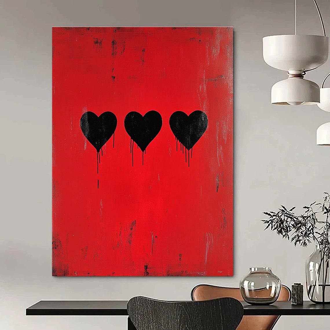 A large abstract painting featuring three black hearts on a red background inspired by Banksy’s minimalistic style.STSC1442