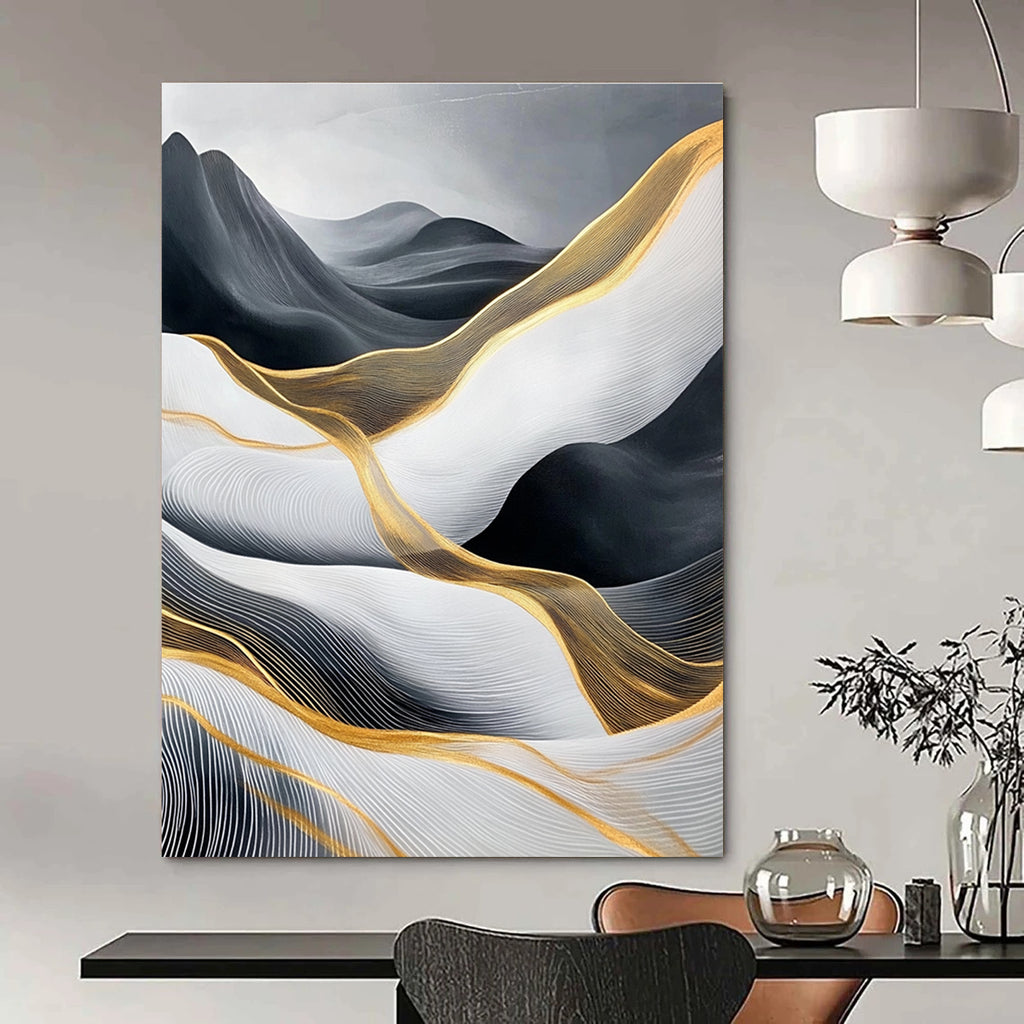 Large abstract painting of flowing waves in light gray and black with gold accents and prominent white areas and mountains.STSC358