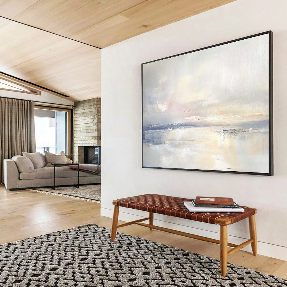 A large abstract painting featuring an open sky and gentle clouds in muted pastels, blending into serene waters for a tranquil ambiance.SC556