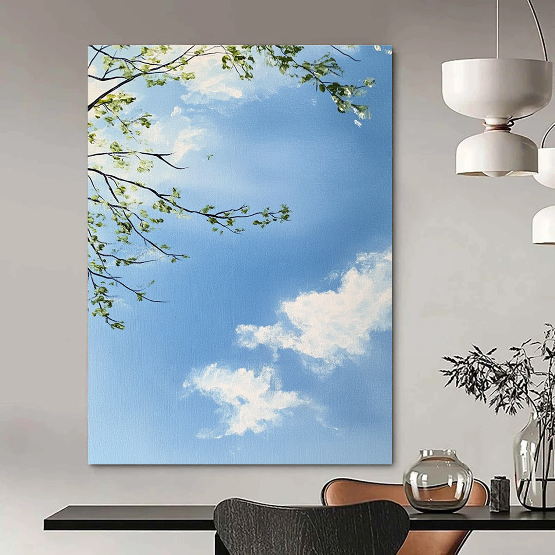 A large abstract painting capturing a serene sky with branches and leaves featuring delicate brushstrokes and soft colors for a tranquil atmosphere.STSC1195