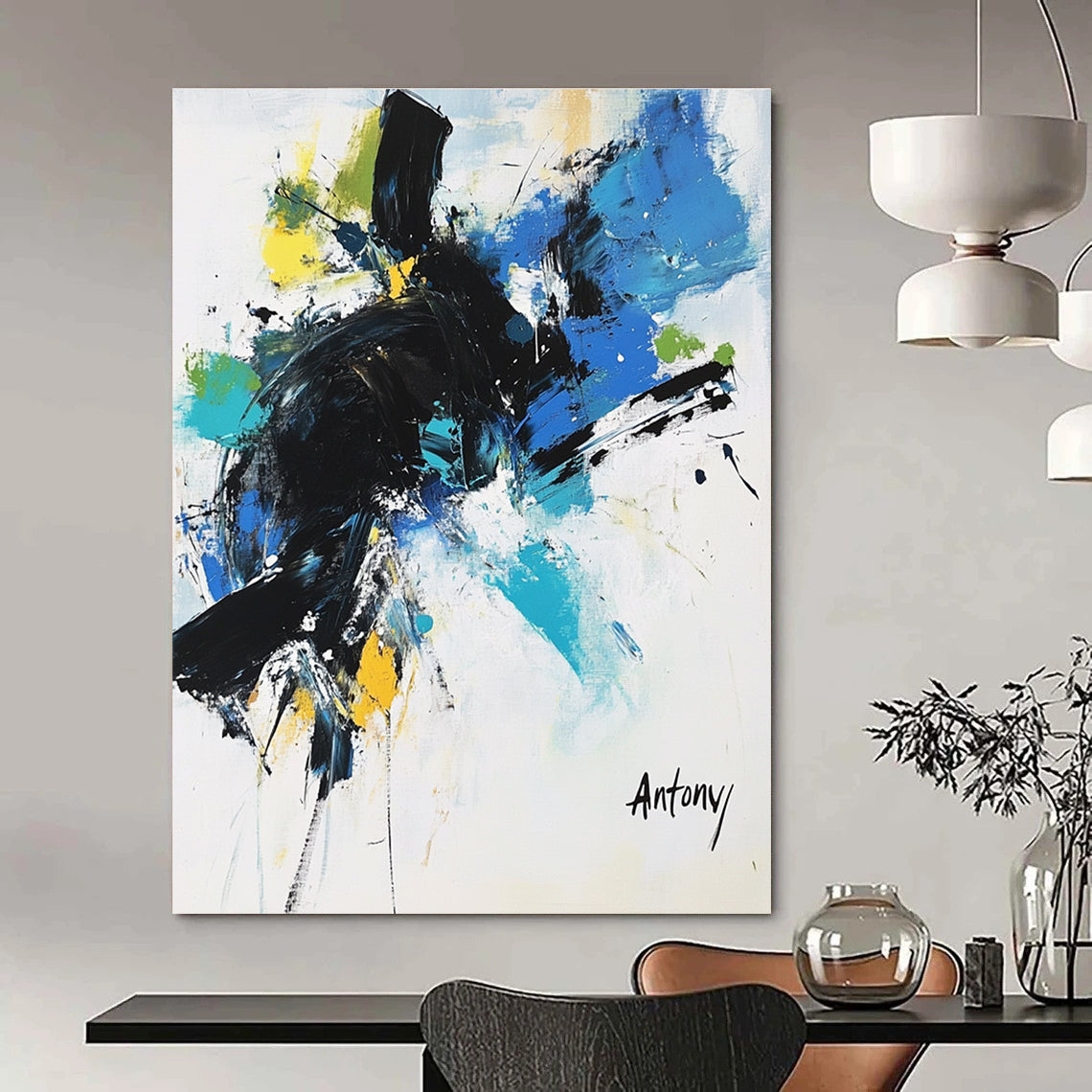 Abstract painting with black brush strokes and blue green yellow accents featuring the name Antony in large letters against a white background.STSC038