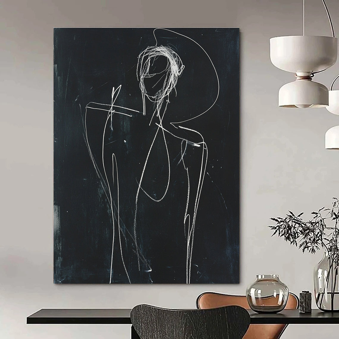 A large abstract sketch depicting a human figure in white chalk on black paper with raised arm and minimalist facial opening.STSC977