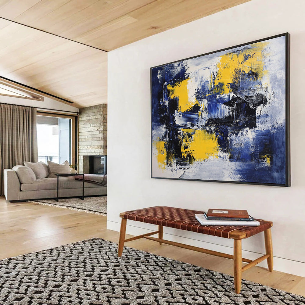 Large abstract painting featuring deep blue, white, and yellow accents with impressionist brush strokes on canvas ideal for modern wall decor.SC031
