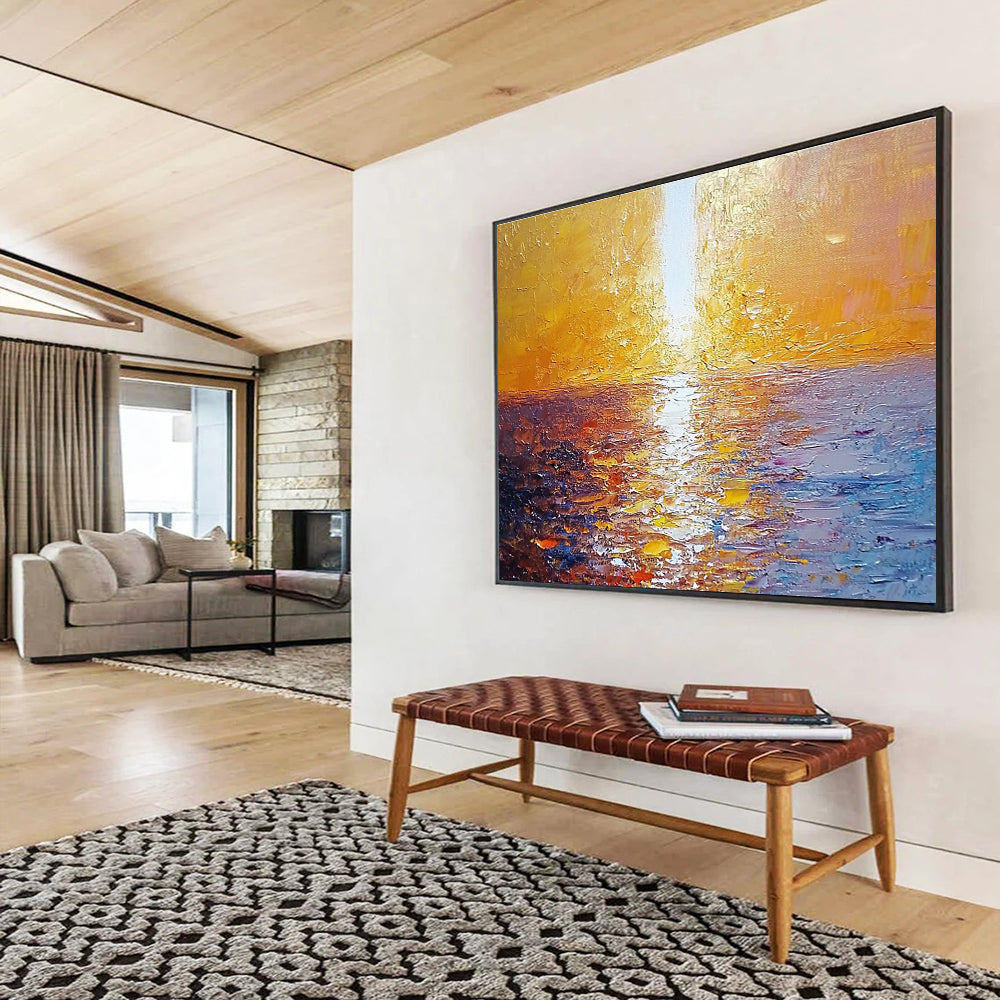 Large abstract painting of a golden sunset over the sea with a white beam illuminating the water surface from the top-left corner.SC111