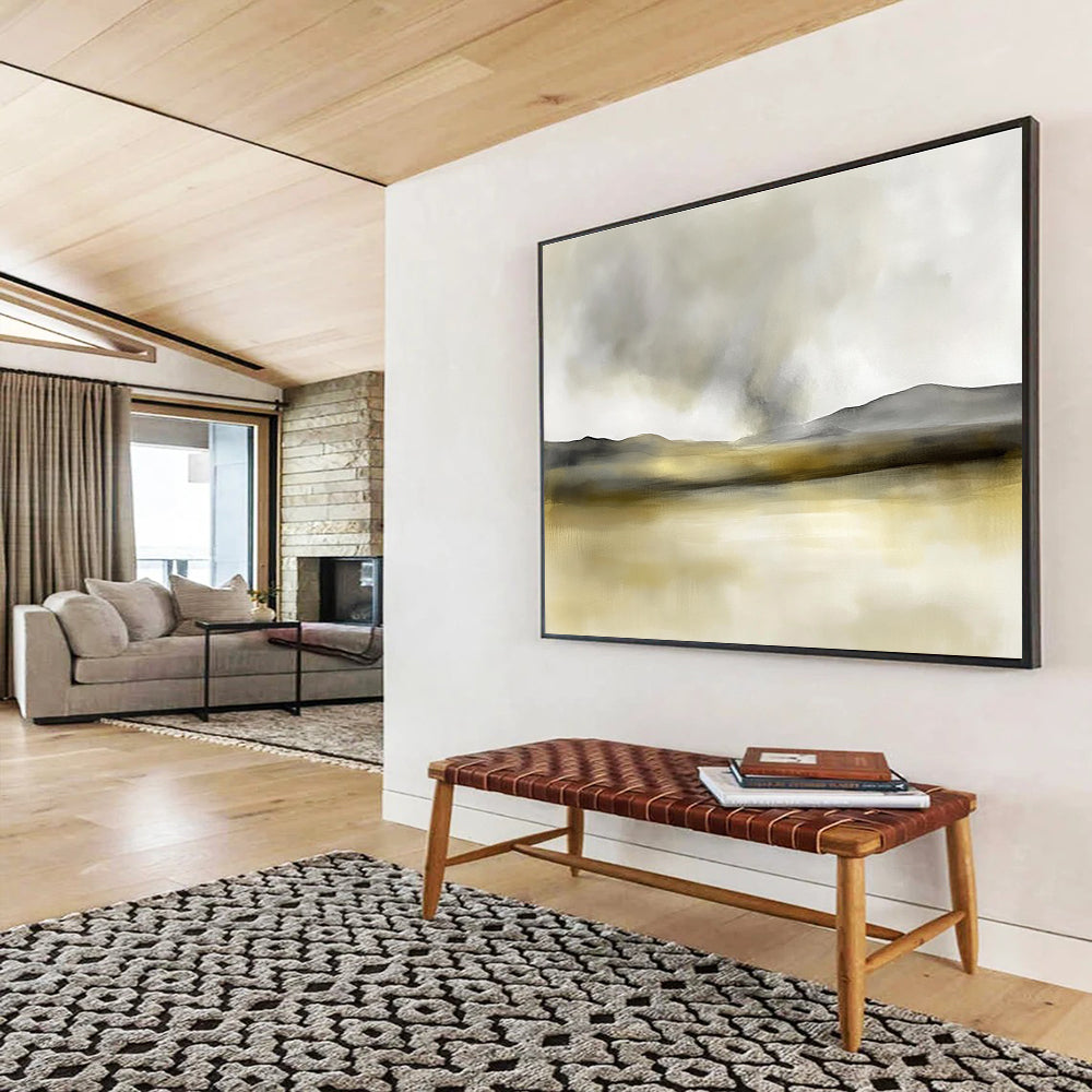 Large abstract painting in soft watercolors featuring neutral beige and gray tones with yellow accents and distant rolling hills under smoke.SC075