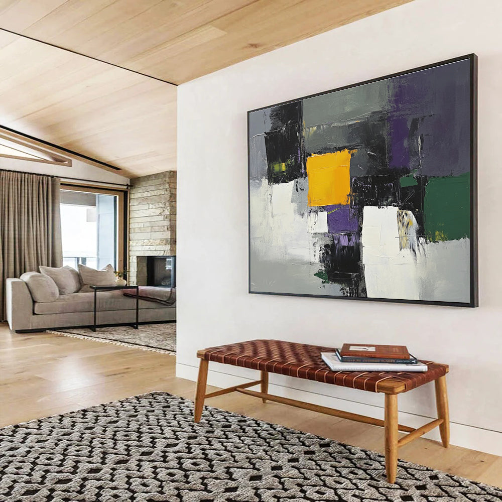This large abstract painting features gray white and purple shapes with a central yellow square and green and olive accents using thick brush strokes.SC324