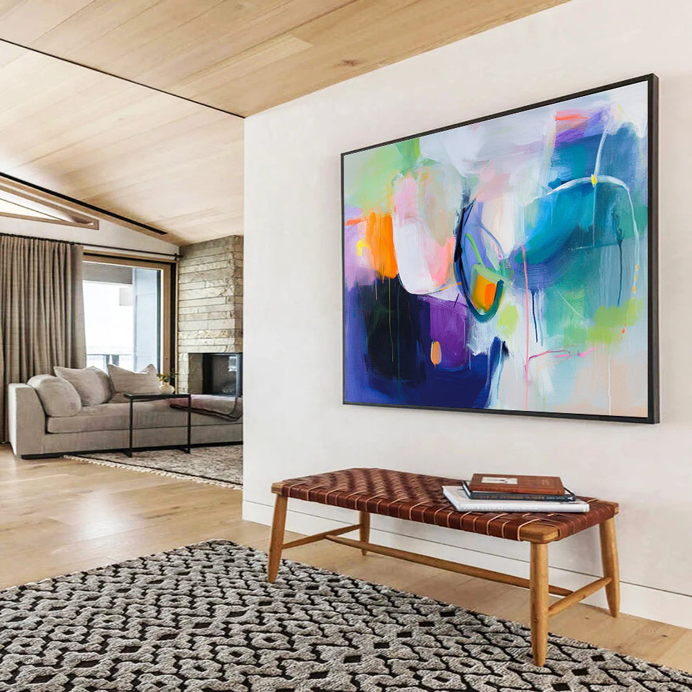 A large abstract painting featuring a colorful background with soft shapes and bold colors, evoking movement and energy with hints of pink blue green and more.SC312