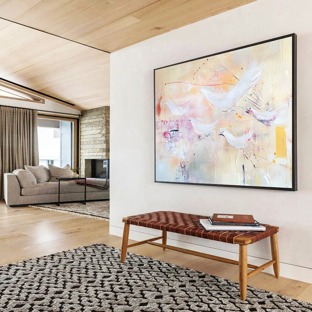 Large abstract painting with soft pastels featuring flying birds and textured layers evoking freedom and movement against a warm beige background.SC385