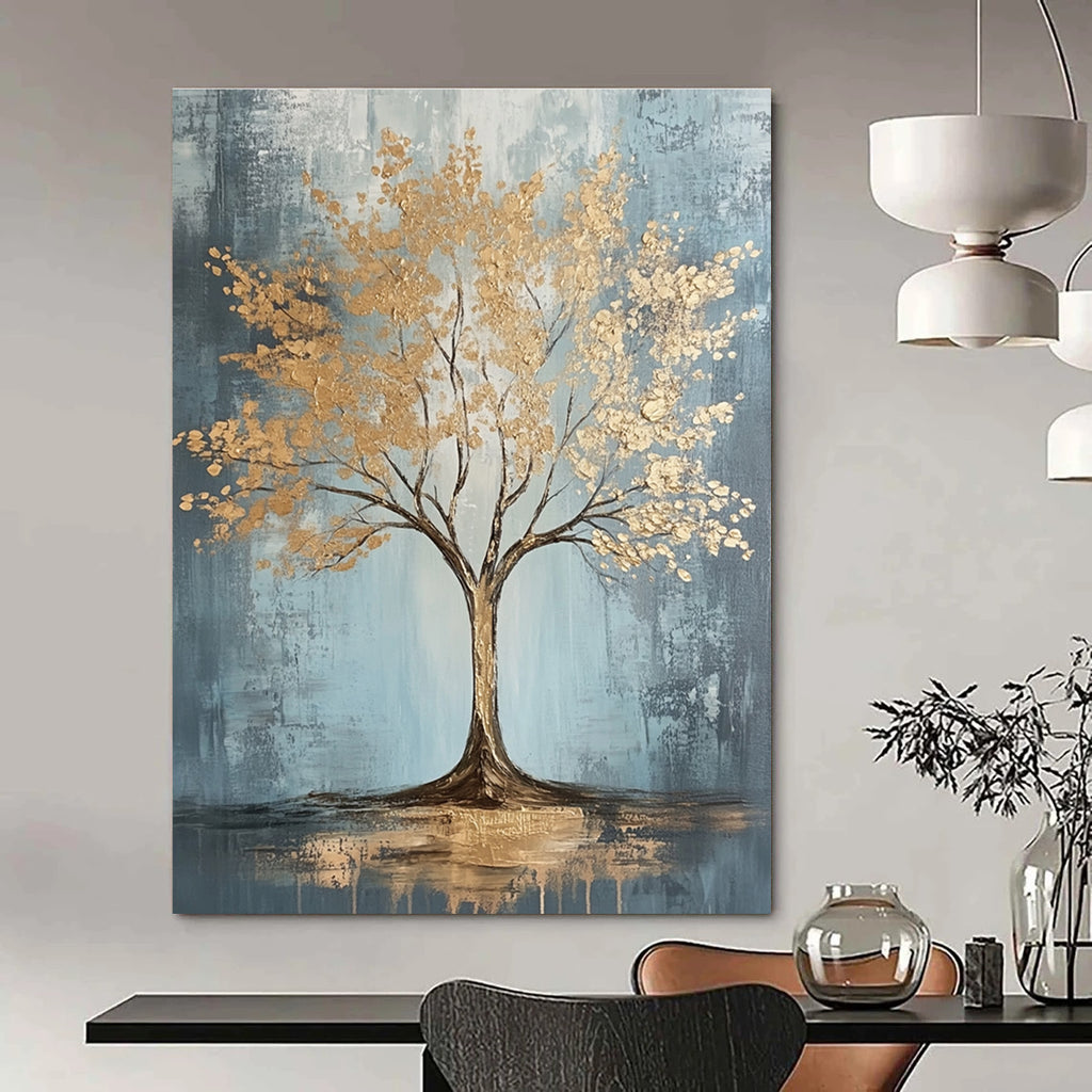 Large abstract painting with gold leaf accents on grey and light blue textured canvas featuring dynamic brush strokes and warm lighting, embodying sophisticated bohemian style.STSC493