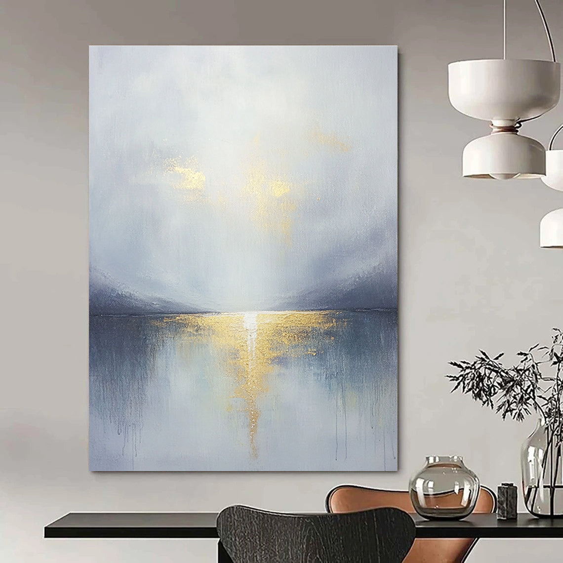 Large abstract painting featuring a grey sky clouds gold horizon and a tranquil lake in the foreground with soft muted colors.STSC289