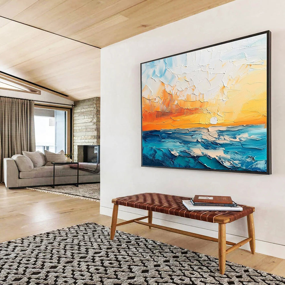 Large abstract painting featuring a textured sunset over the sea and sky in orange blue white and teal shades.SC132