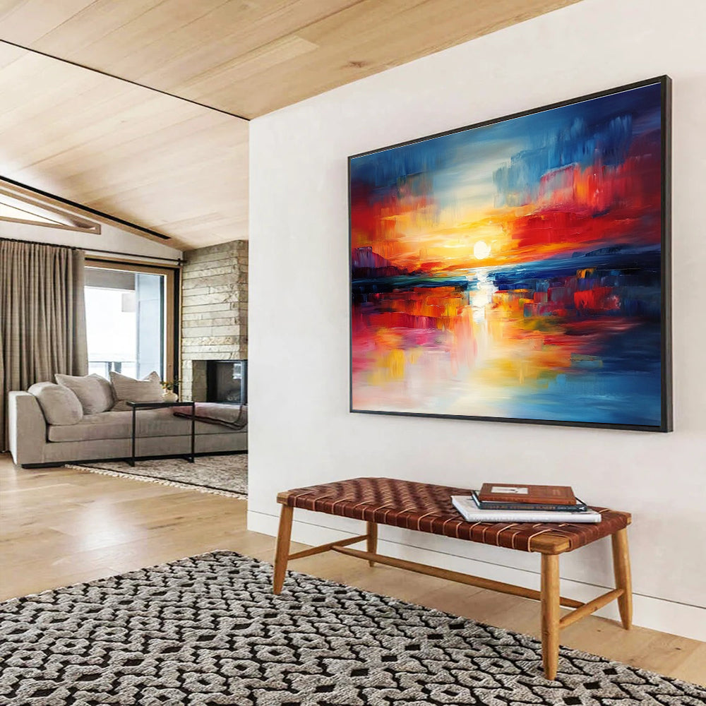 A large abstract painting capturing a vibrant sunset with blue and red hues reflecting on calm waters, creating a dynamic central composition.SC561