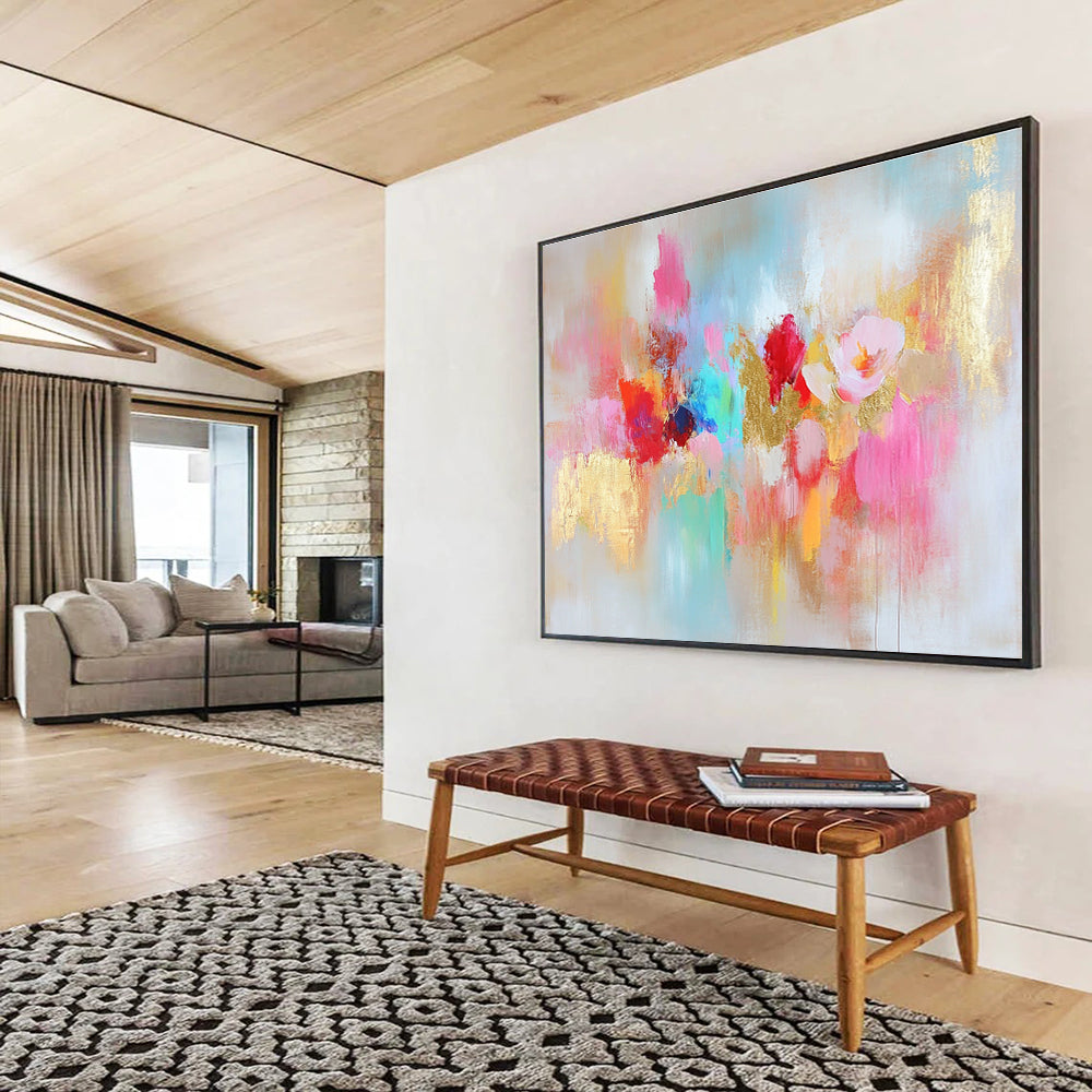 Large abstract painting with vibrant colors and gold leaf accents symbolizing happiness creativity and hope on a soft textured white background.SC264