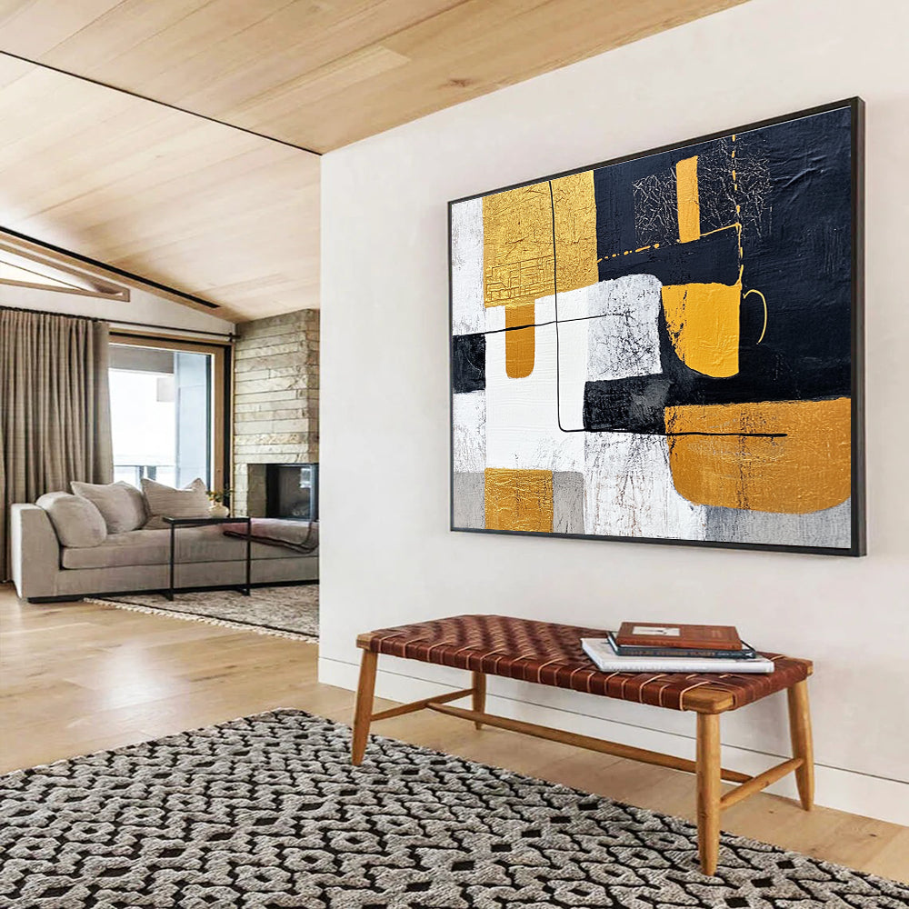 Large abstract painting featuring white and yellow shapes with black lines on a dark gray background inspired by Chinese landscapes and embellished with gold leaf.SC266